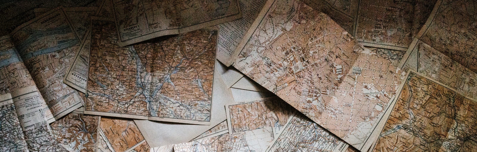 Old historical maps spread out